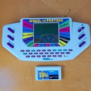 Vintage 1999 Tiger Wheel of Fortune hand held electronic game show game Tested